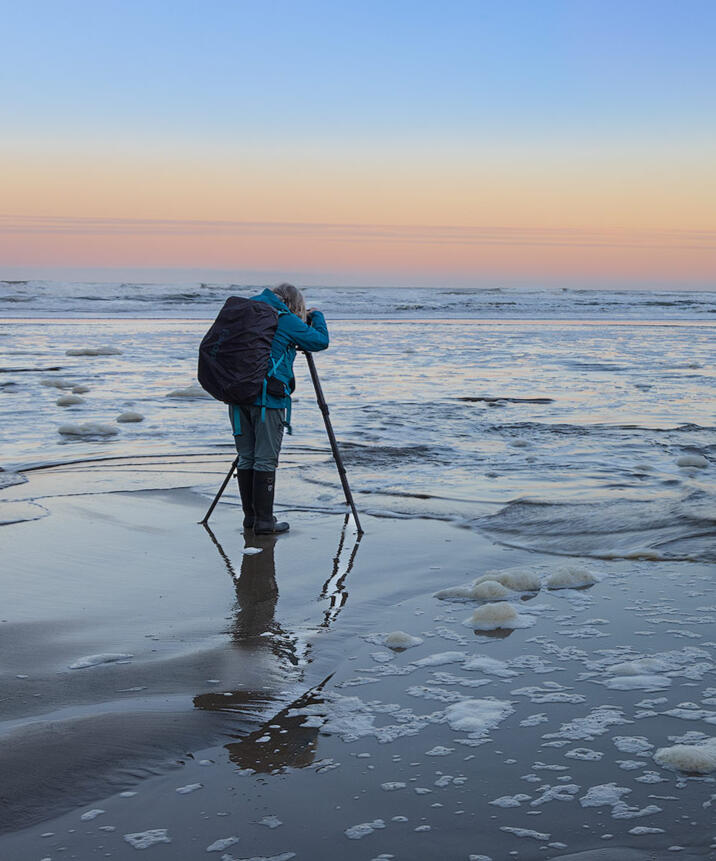Photographer in action on the Oregon coast